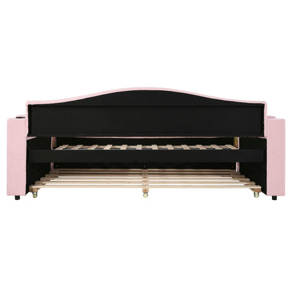 Upholstered pink daybed with black curved headboard, storage armrests and trundle on Tampa Home & Garden Store