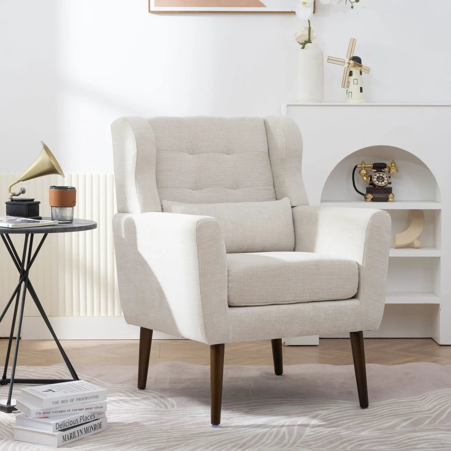 Beige foam-filled mid-century accent chair with dark wooden legs in living room setting on Tampa Home & Garden Store