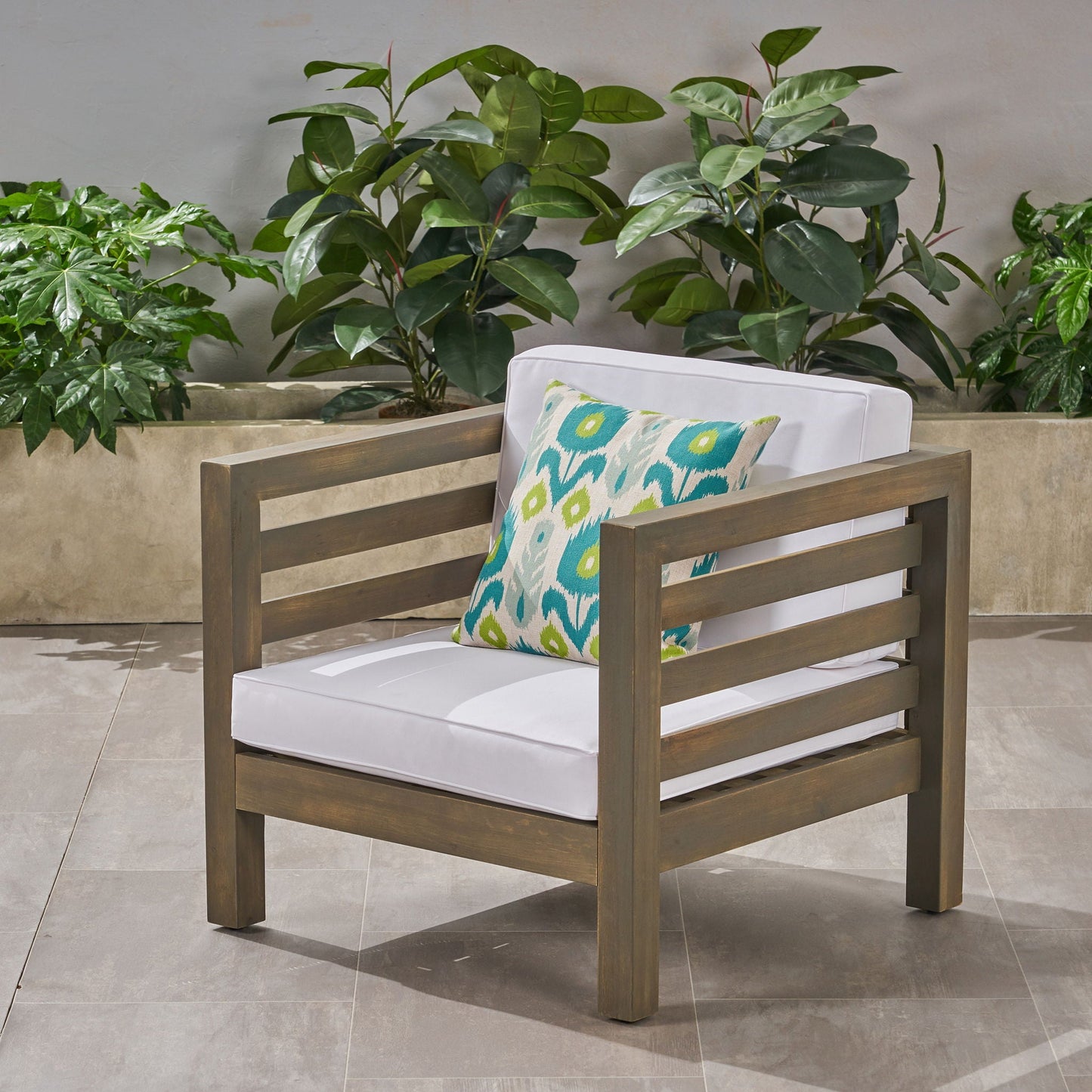 Outdoor acacia wood arm chair with white cushion and turquoise pillow by HouseOfZazla on Tampa Home & Garden Store