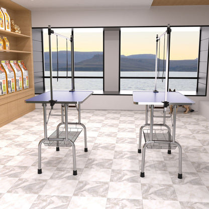 Large grooming tables with adjustable arms and clamps, blue textured tops on Tampa Home & Garden Store