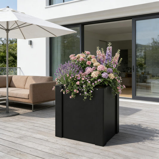 Planter Bed elevated outdoor planter box by HouseOfZazla, black metal with pink flowers on Tampa Home & Garden Store