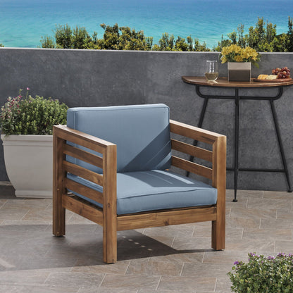 Outdoor acacia wood patio chair with blue fabric cushion by HouseOfZazla on Tampa Home & Garden Store