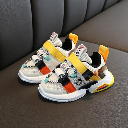 Stevvex infant sneakers pair, non-slip breathable shoes with yellow strap and panels on Tampa Home & Garden Store