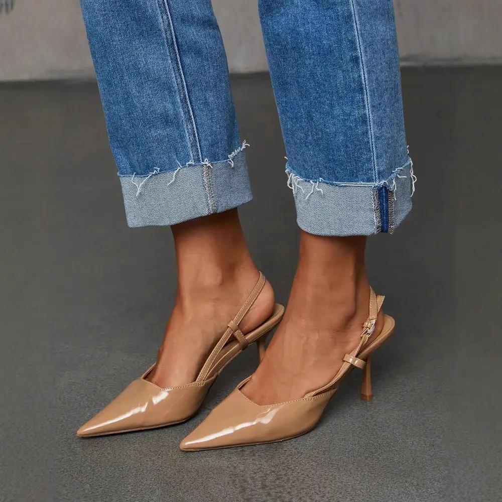 Cuffed denim Capri pants with whiskering and frayed cuffs paired with nude slingback heels on Tampa Home & Garden Store
