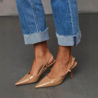 Cuffed denim Capri pants with whiskering and frayed cuffs paired with nude slingback heels on Tampa Home & Garden Store