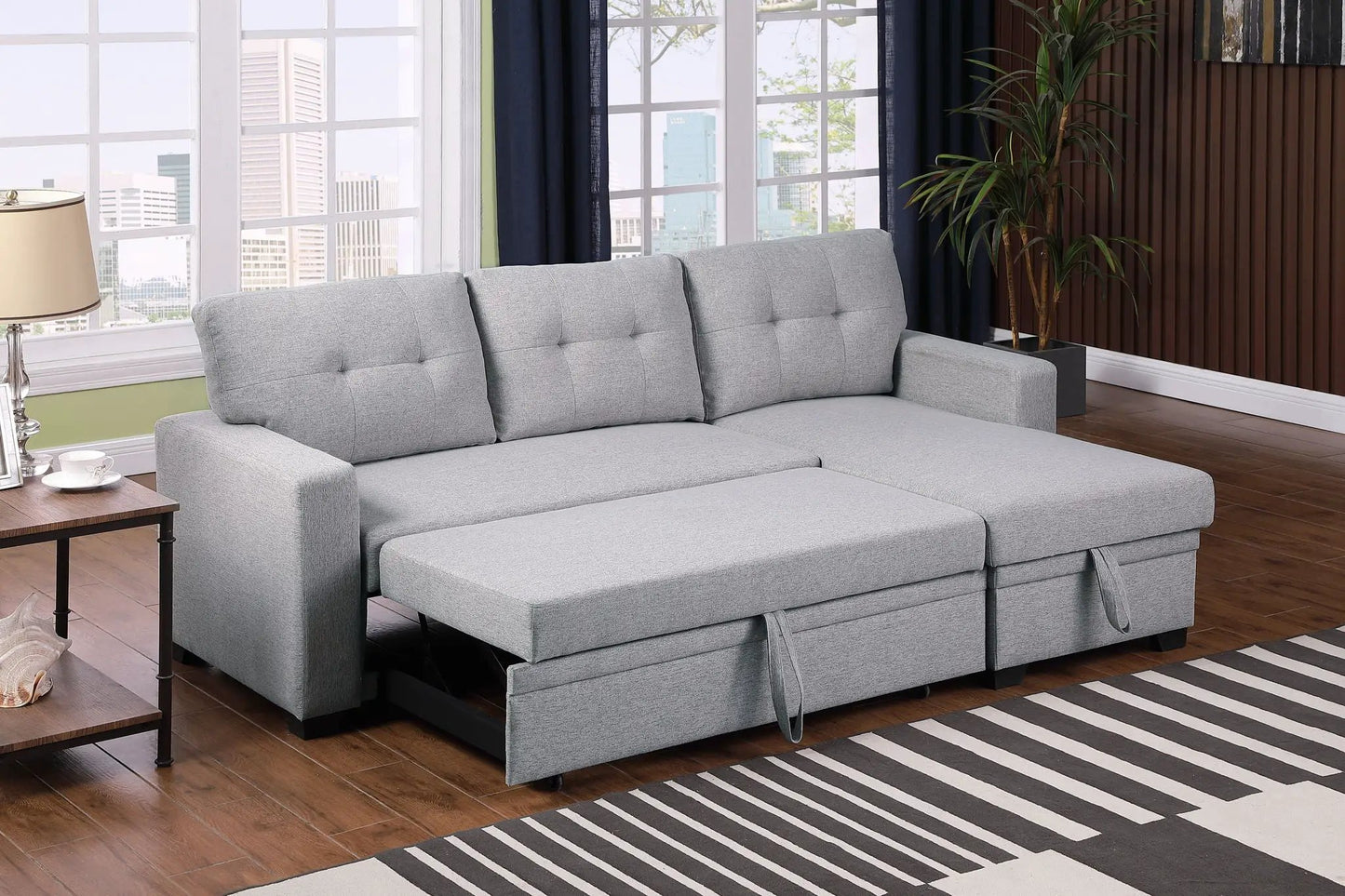 Upholstered pull-out sleeper sectional sofa with chaise in gray fabric, tufted cushions on Tampa Home & Garden Store