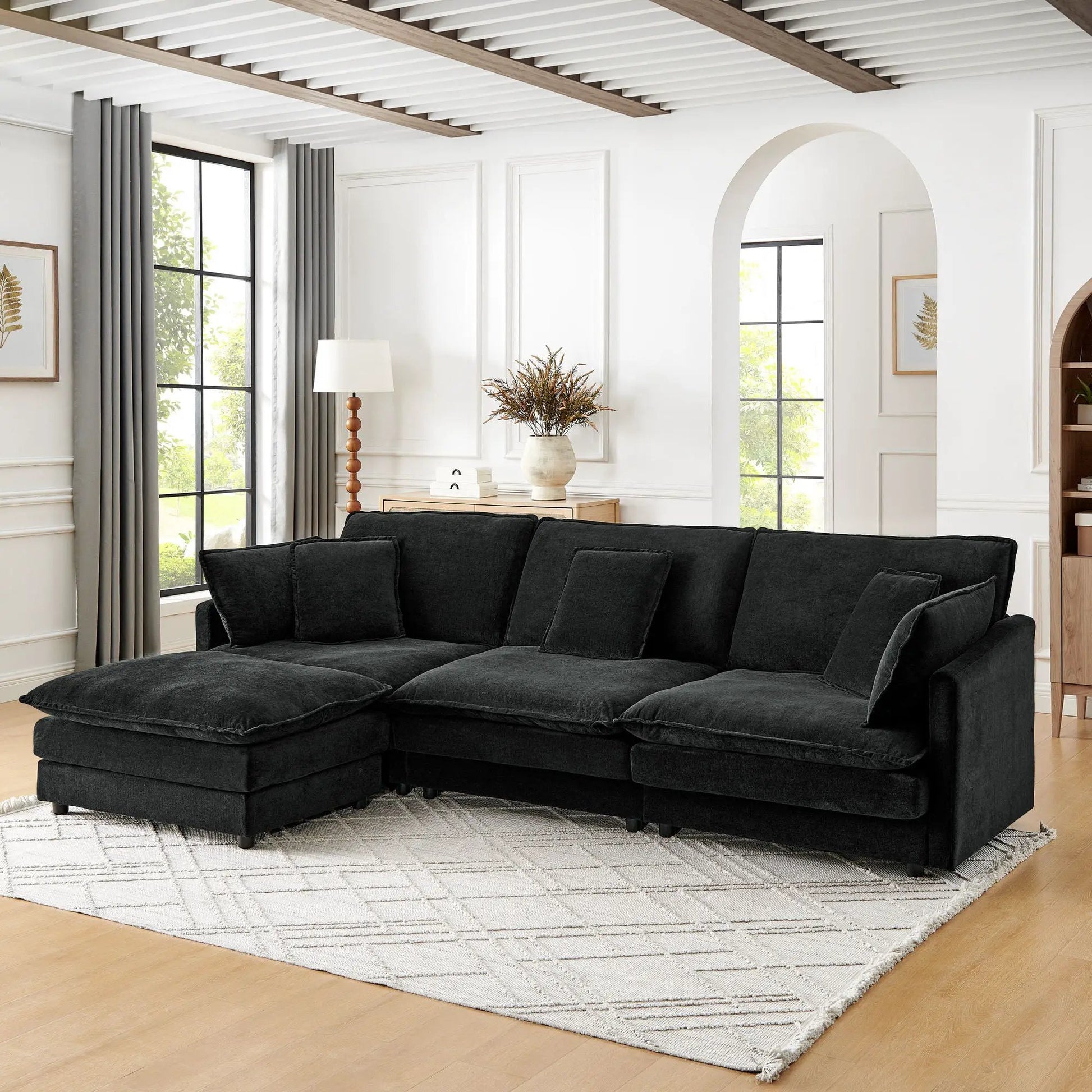 L-shaped sectional sofa with ottoman in black fabric, convertible 4-seater living room set on Tampa Home & Garden Store