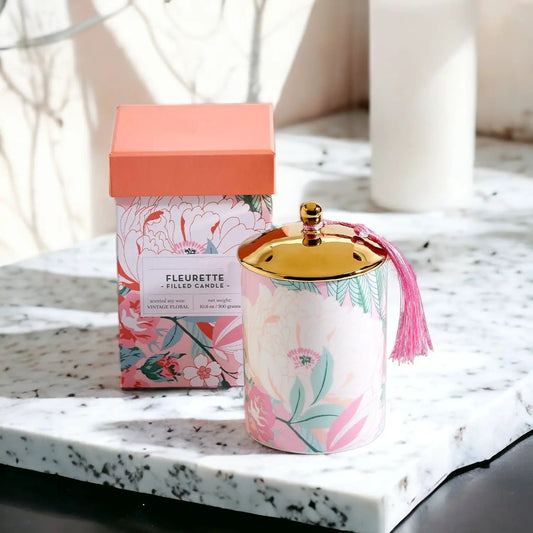 Vintage floral candle set Gia Roma; pastel tin with gold lid and pink tassel beside a box on Tampa Home & Garden Store