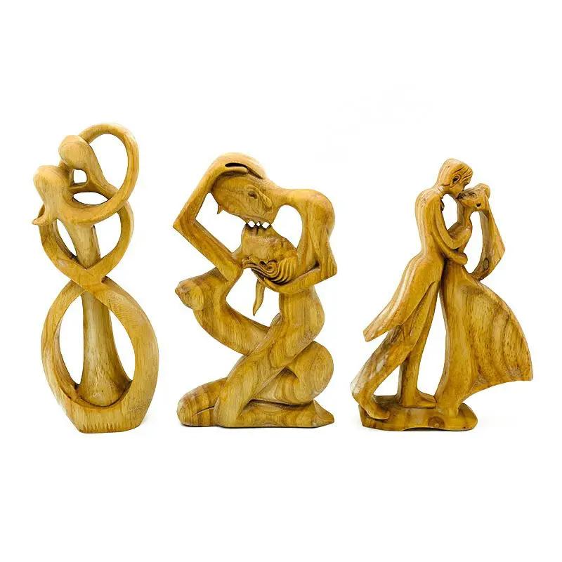 Wooden love-themed decoration: 3 light wood carved figures loop, kissing couple, dancing couple on Tampa Home & Garden Store