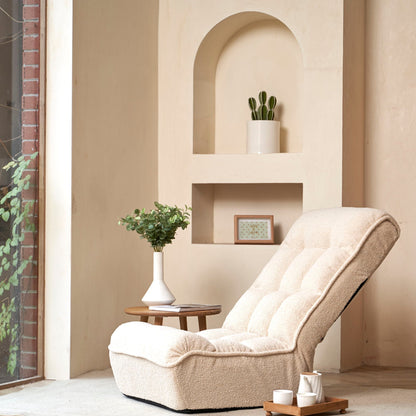 Reclining chair with beige plush upholstery sits in a cozy balcony nook with plants on Tampa Home & Garden Store