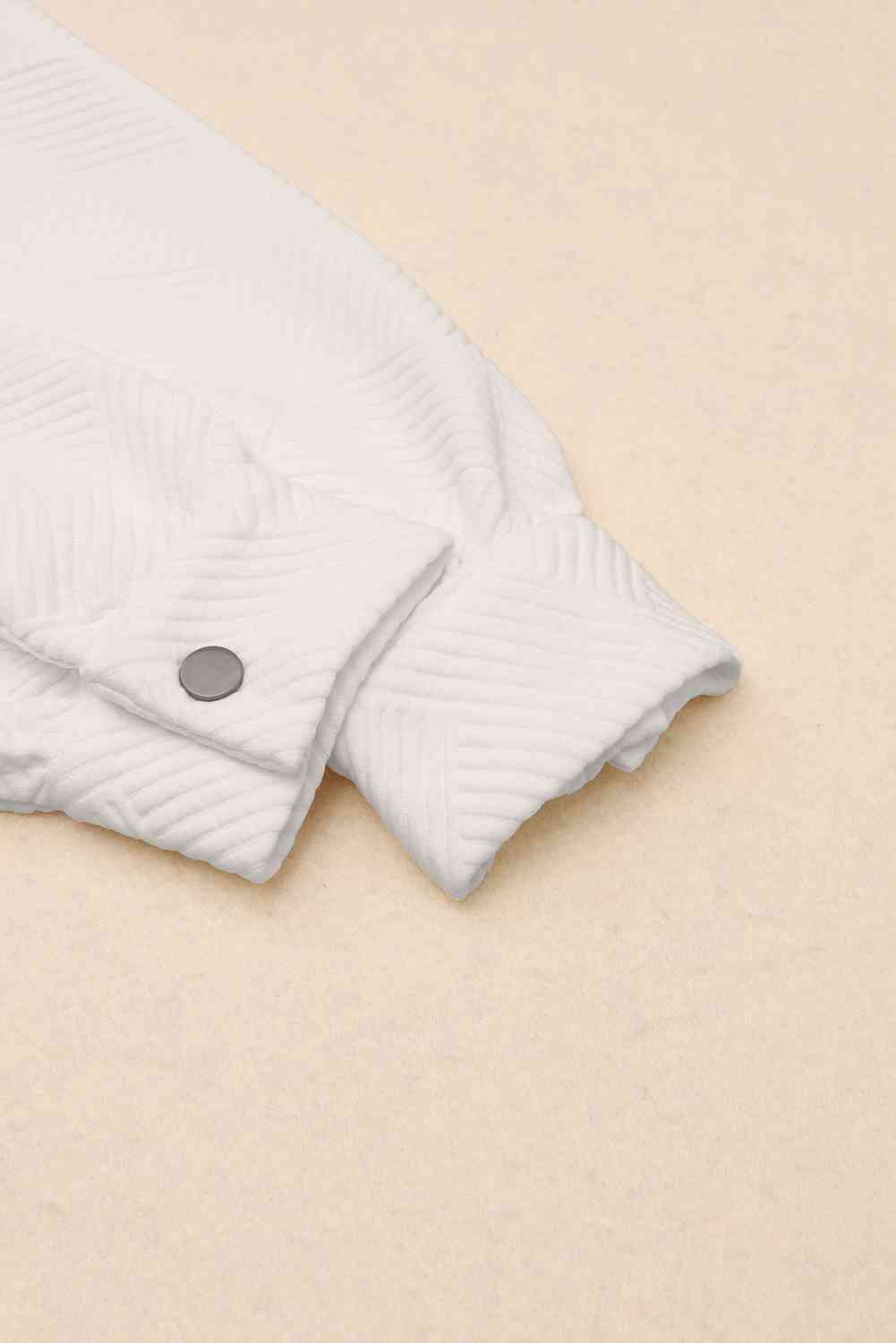 White quilted jacket cuff with a snap-front button on Tampa Home & Garden Store