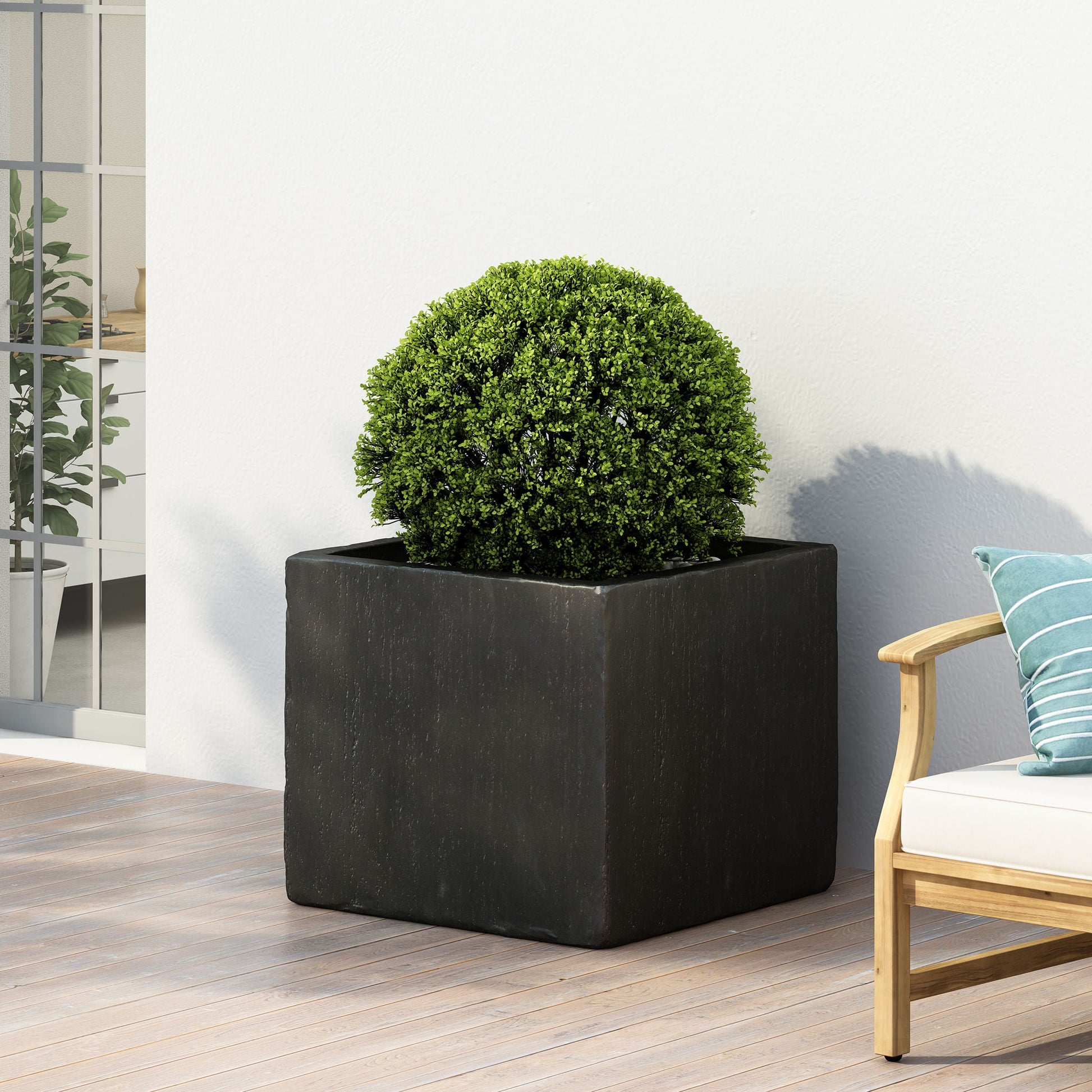 Modern Outdoor Planter by HouseOfZazla: black square planter with a lush green topiary on Tampa Home & Garden Store