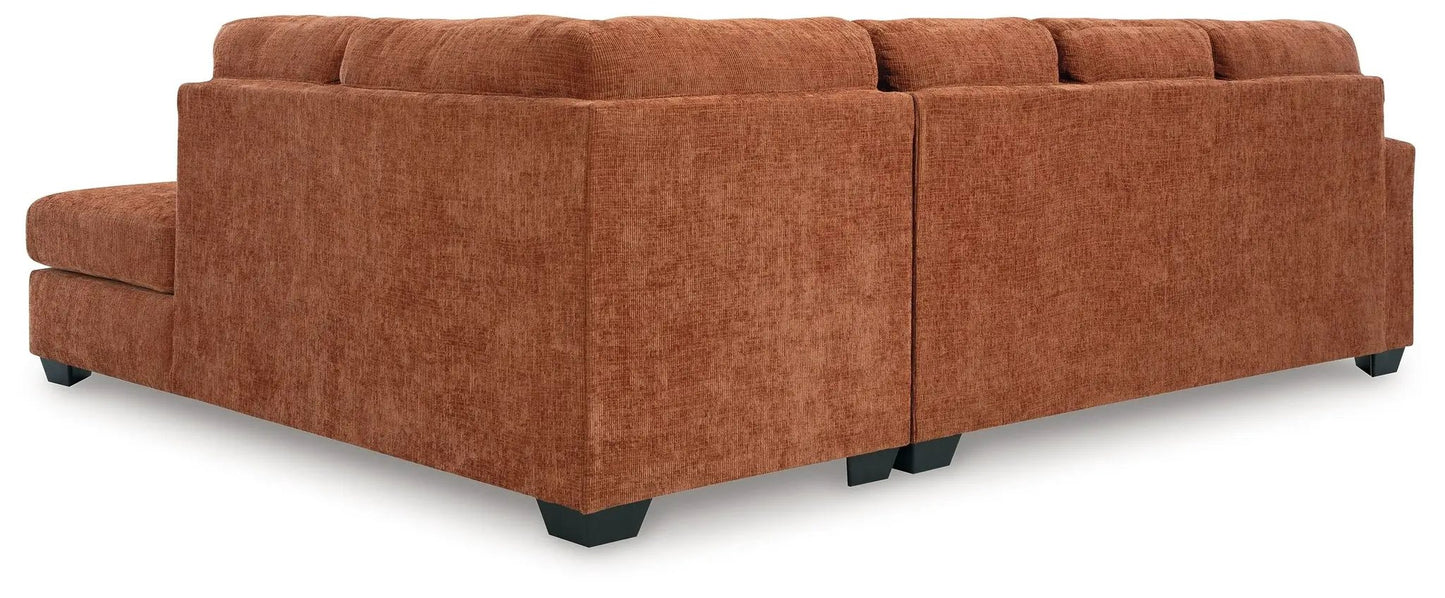 Aviemore sectional by Unique Piece Furniture in burnt orange fabric with black legs on Tampa Home & Garden Store