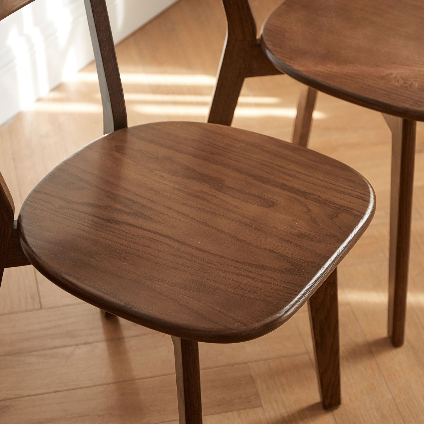 Simple dining chairs in dark walnut wood with rounded seats by Unique Piece Furniture on Tampa Home & Garden Store