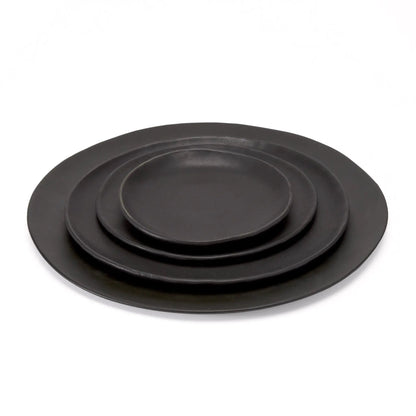 Kodo 4 Piece Place Setting plates by dumæ, black matte dinnerware set of four, stacked on Tampa Home & Garden Store