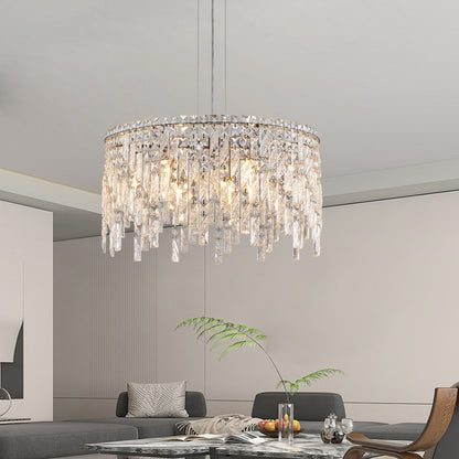 24-inch round silver crystal chandelier with cascading prisms in a modern living room over a glass coffee table on Tampa Home & Garden Store
