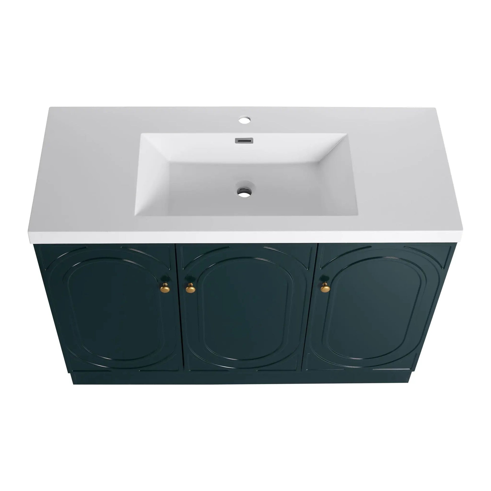 Contemporary freestanding vanity with white resin sink and navy cabinet doors with brass knobs on Tampa Home & Garden Store
