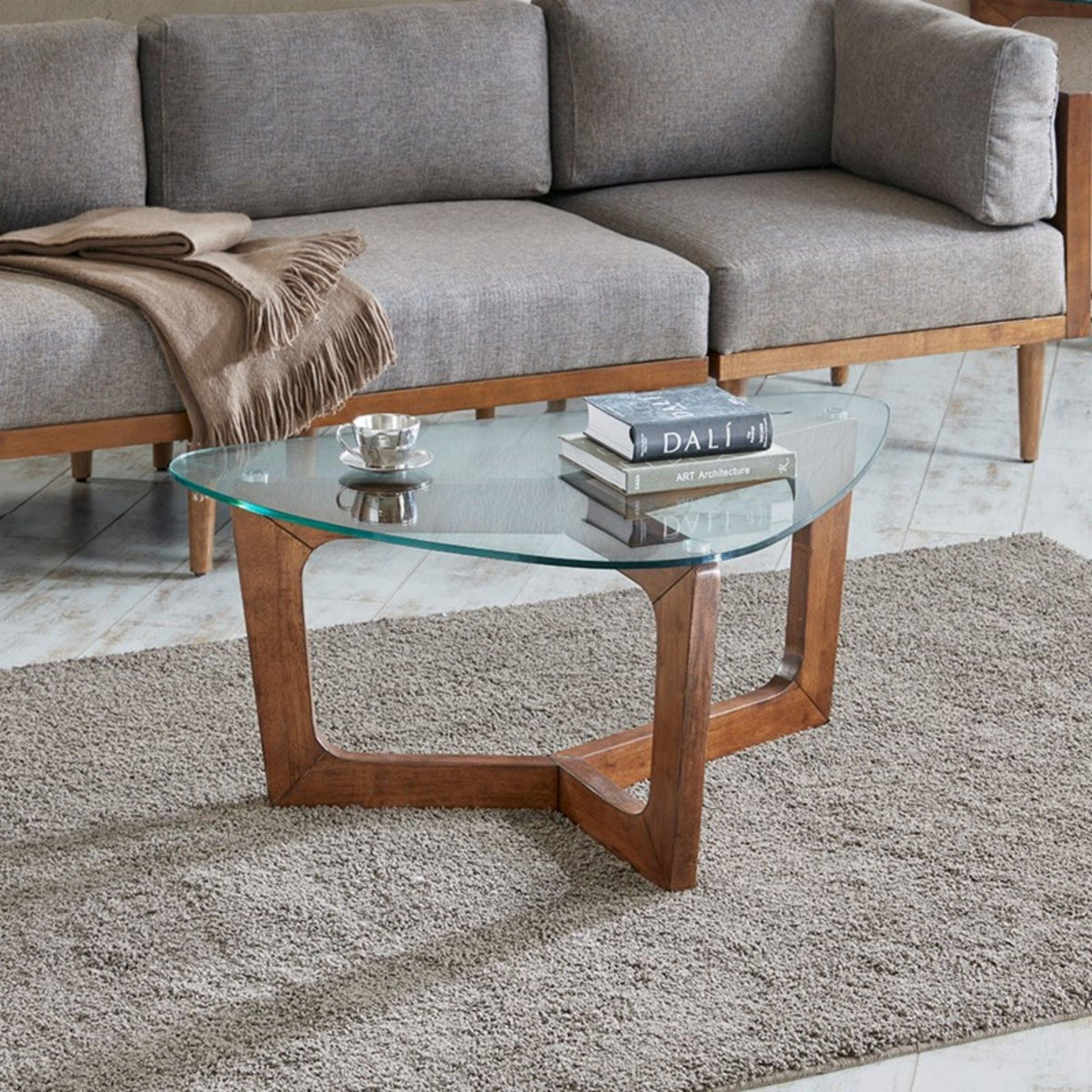 Walker coffee table with tempered glass top and brown wood base, round design by HouseOfZazla on Tampa Home & Garden Store