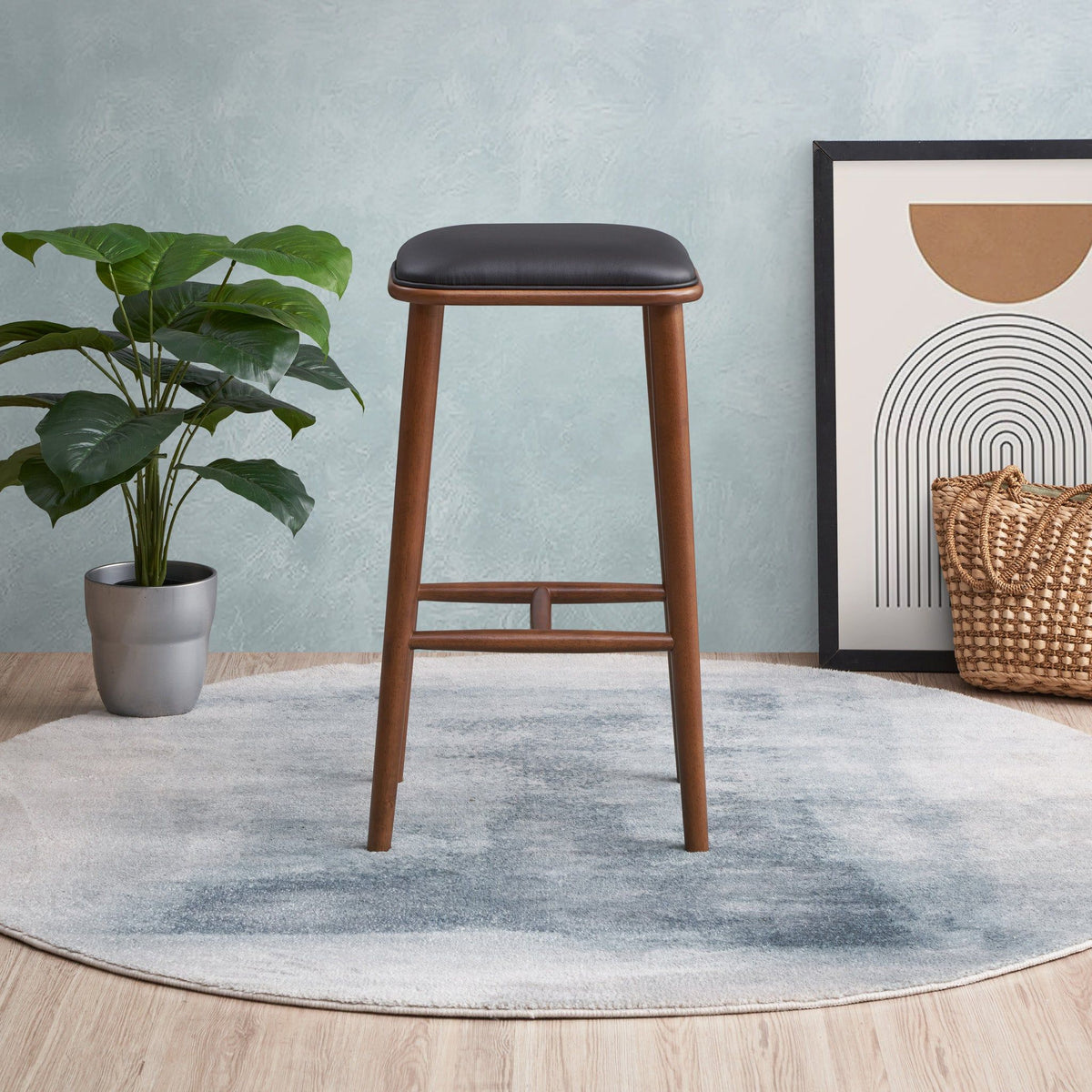 Bar height stool 28-30in with black upholstered seat and warm wood legs on Tampa Home & Garden Store