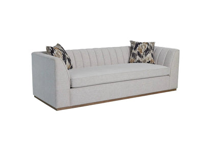 Channel sofa by Unique Piece Furniture off white, channel tufting, 2 pillows on wood base on Tampa Home & Garden Store
