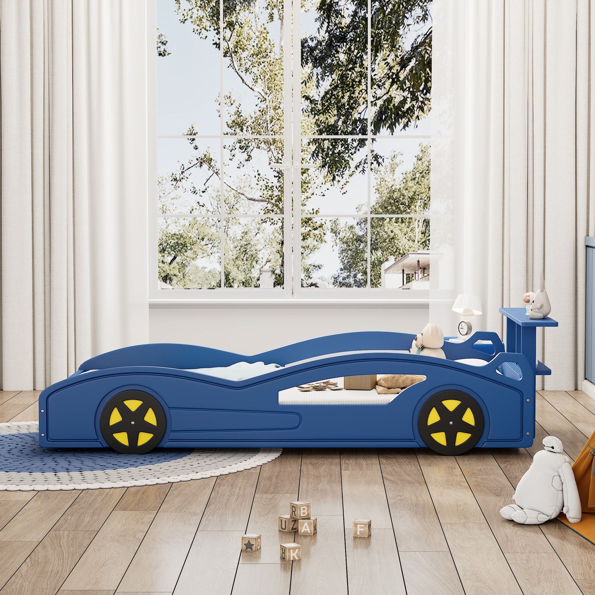 Race Car Platform Bed & Wheels blue bed by HouseOfZazla in a child's room with toy blocks on Tampa Home & Garden Store