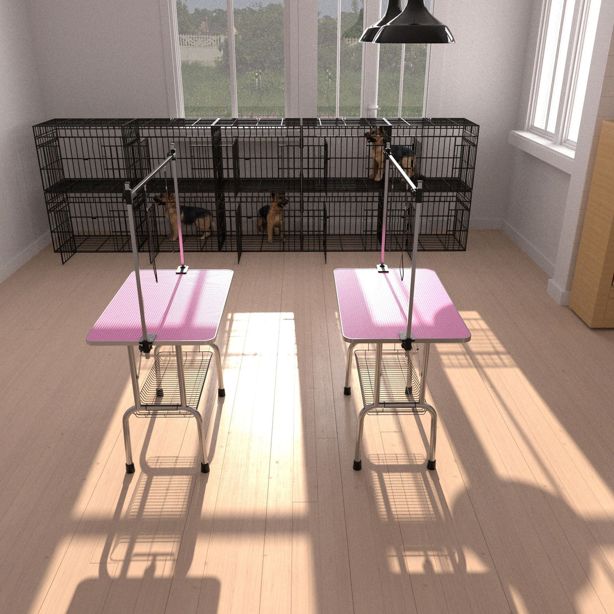 Folding dog grooming tables with pink rubber mats and adjustable arms beside kennels on Tampa Home & Garden Store