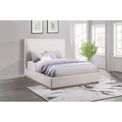 Othello platform bed cream upholstered bed with tall headboard in light gray bedroom and ferns on Tampa Home & Garden Store