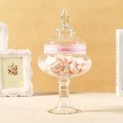 Clear glass candy jar with lid on pedestal stand, pink ribbon, pink and white marshmallows on Tampa Home & Garden Store