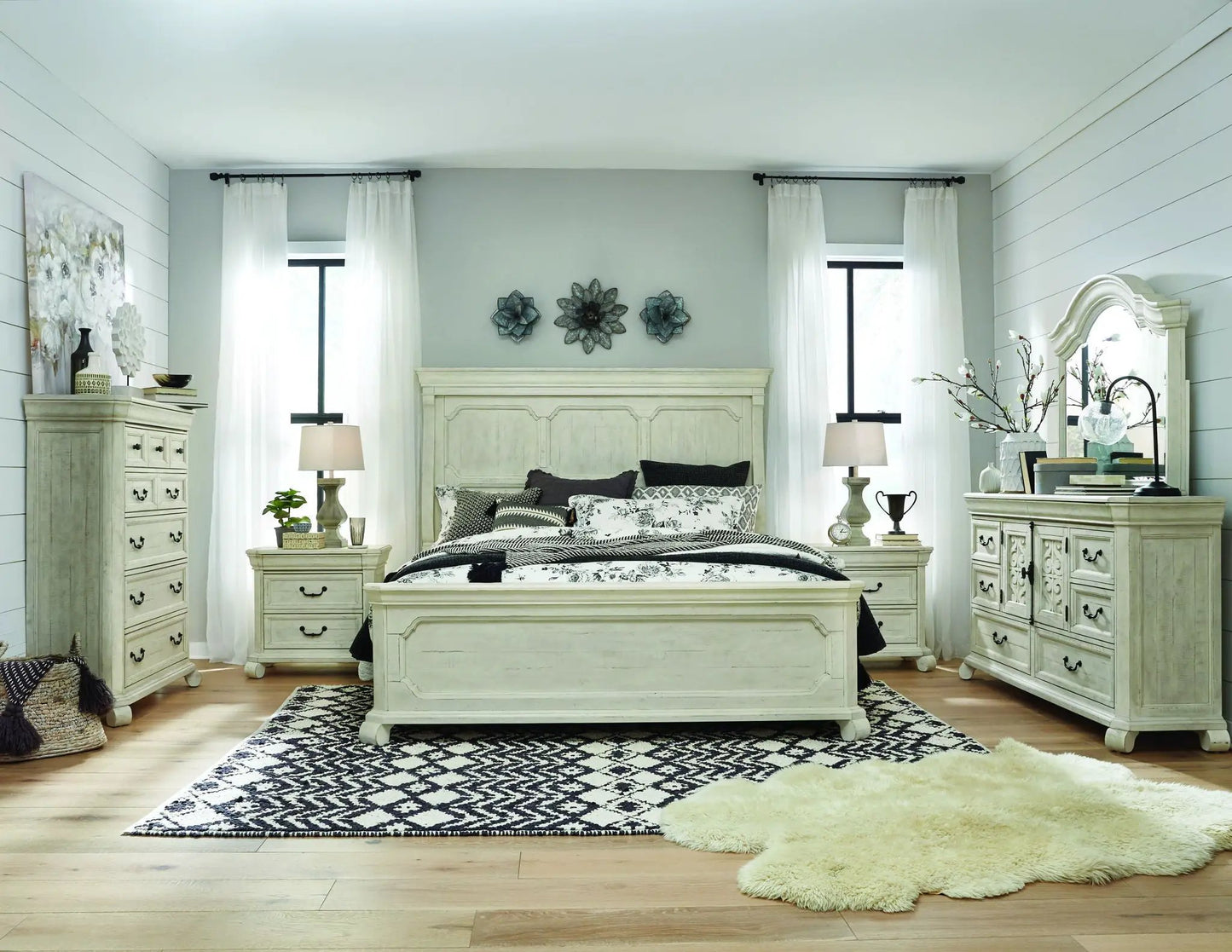 Bronwyn Panel Bed Unique Piece Furniture in distressed white with dressers in a room on Tampa Home & Garden Store