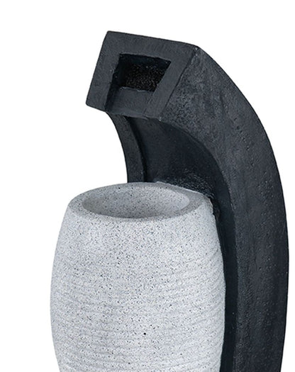 Water fountain with vase design by HouseOfZazla, textured gray ceramic vase and black arc water feature on Tampa Home & Garden Store
