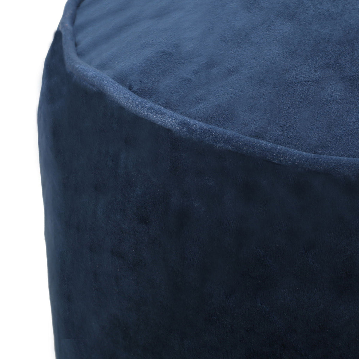 Blue velvet cylinder pouf ottoman close-up on Tampa Home & Garden Store
