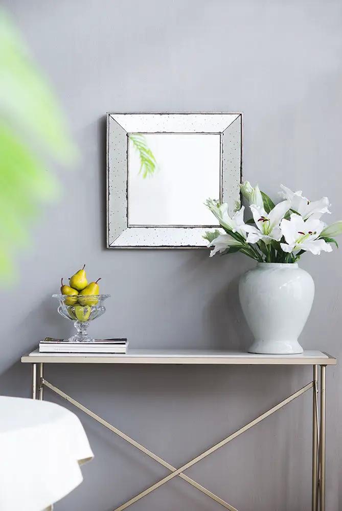 Distressed accent mirror with traditional frame, wall mirror by Unique Piece above a console on Tampa Home & Garden Store
