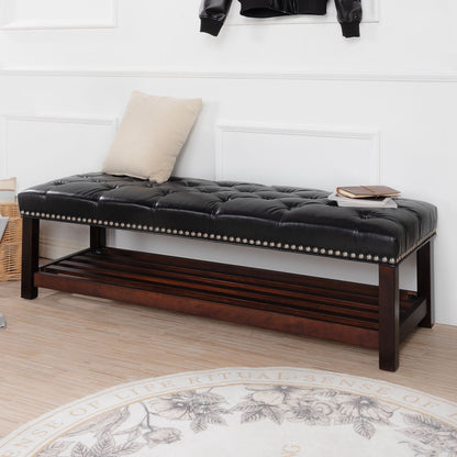 Tufted upholstered end-of-bed bench in black faux leather with nailhead trim on Tampa Home & Garden Store