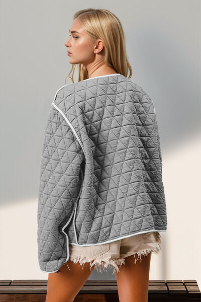 Stevvex gray quilted jacket with white contrast trim, back view on model on Tampa Home & Garden Store