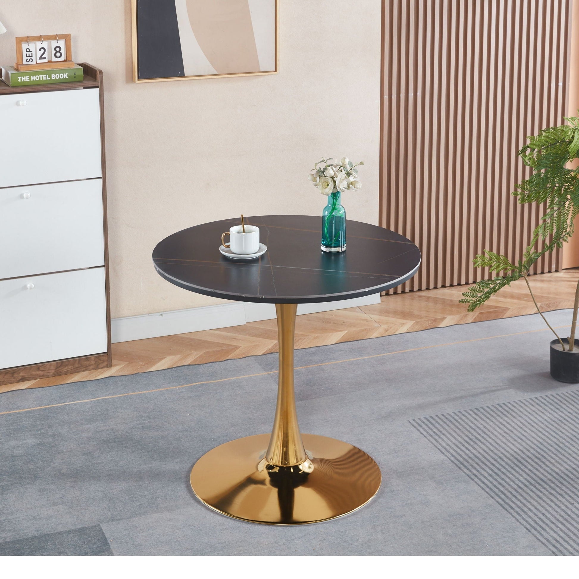 Mid-Century Tulip Dining Table by HouseOfZazla with round black top and gold pedestal base on Tampa Home & Garden Store