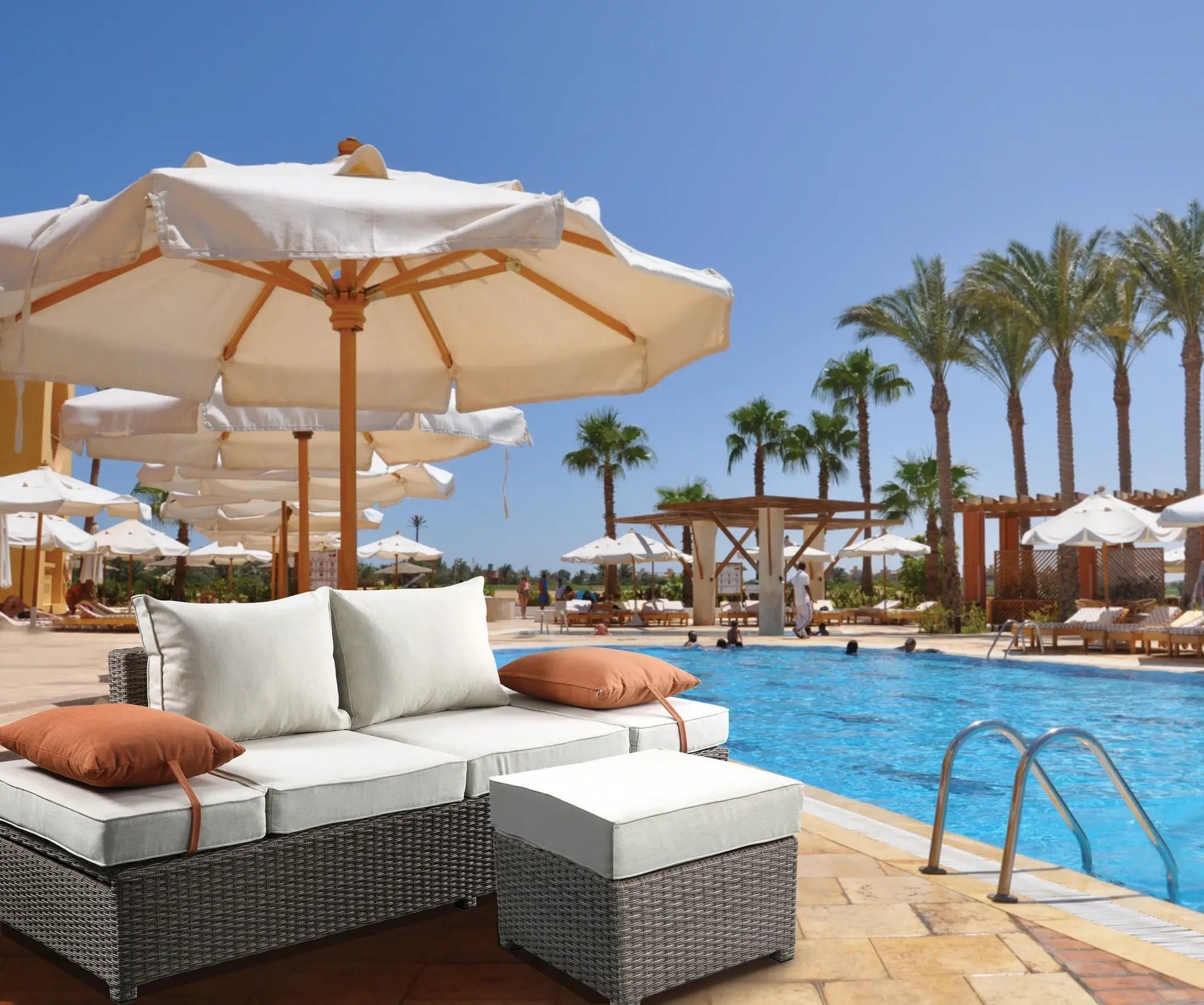 Salena all-weather wicker patio sofa & ottoman with beige cushions and 2 toss pillows, poolside on Tampa Home & Garden Store