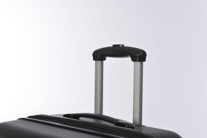 Black hardside spinner suitcase with silver telescoping handle on Tampa Home & Garden Store