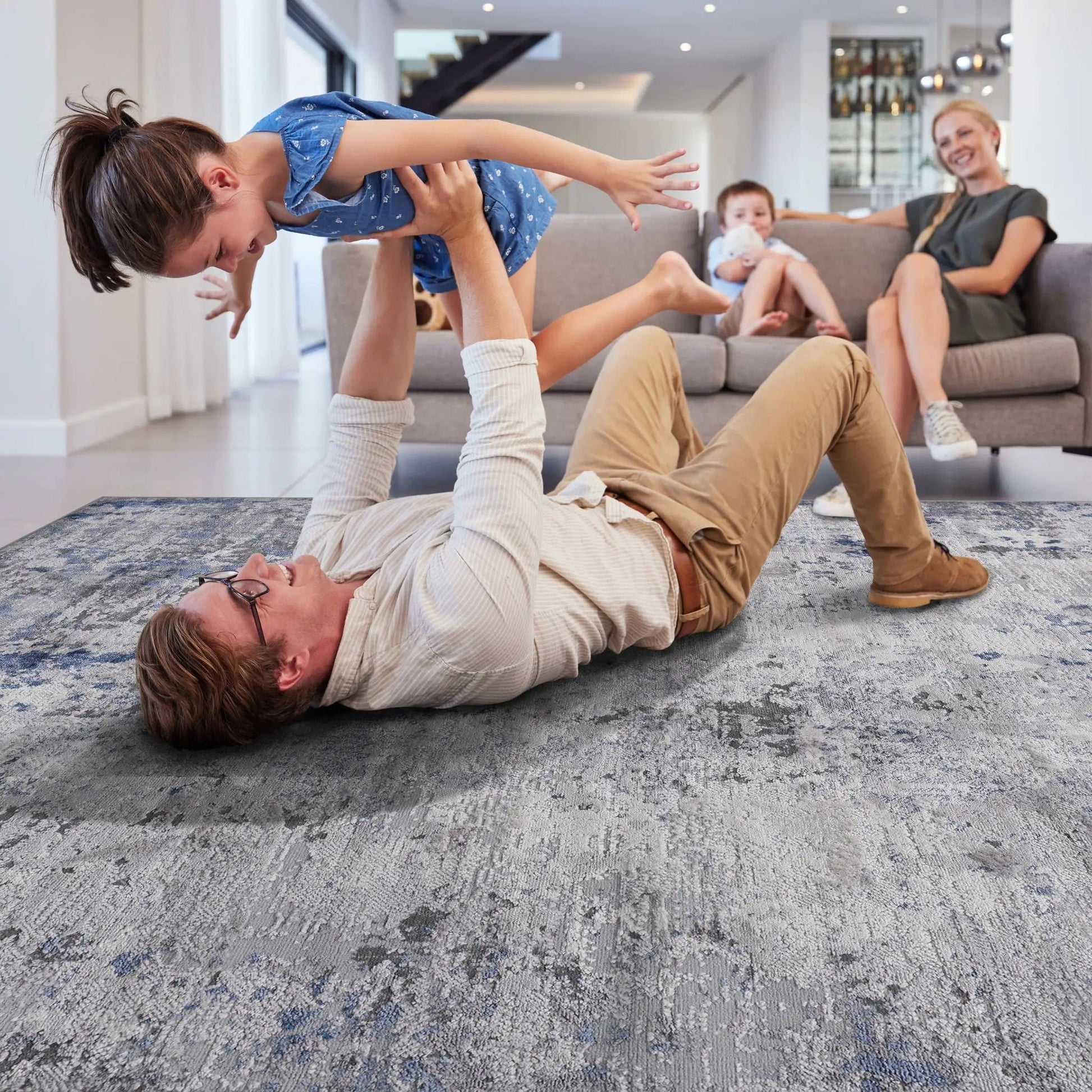 Marfi Abstract Rug, blue-gray patterned area rug by Unique Piece Furniture in living room on Tampa Home & Garden Store