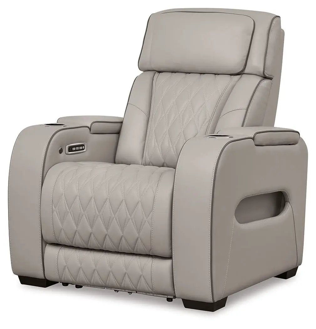 Boyington power recliner with adjustable headrest in beige leather, diamond-stitch back and seat on Tampa Home & Garden Store