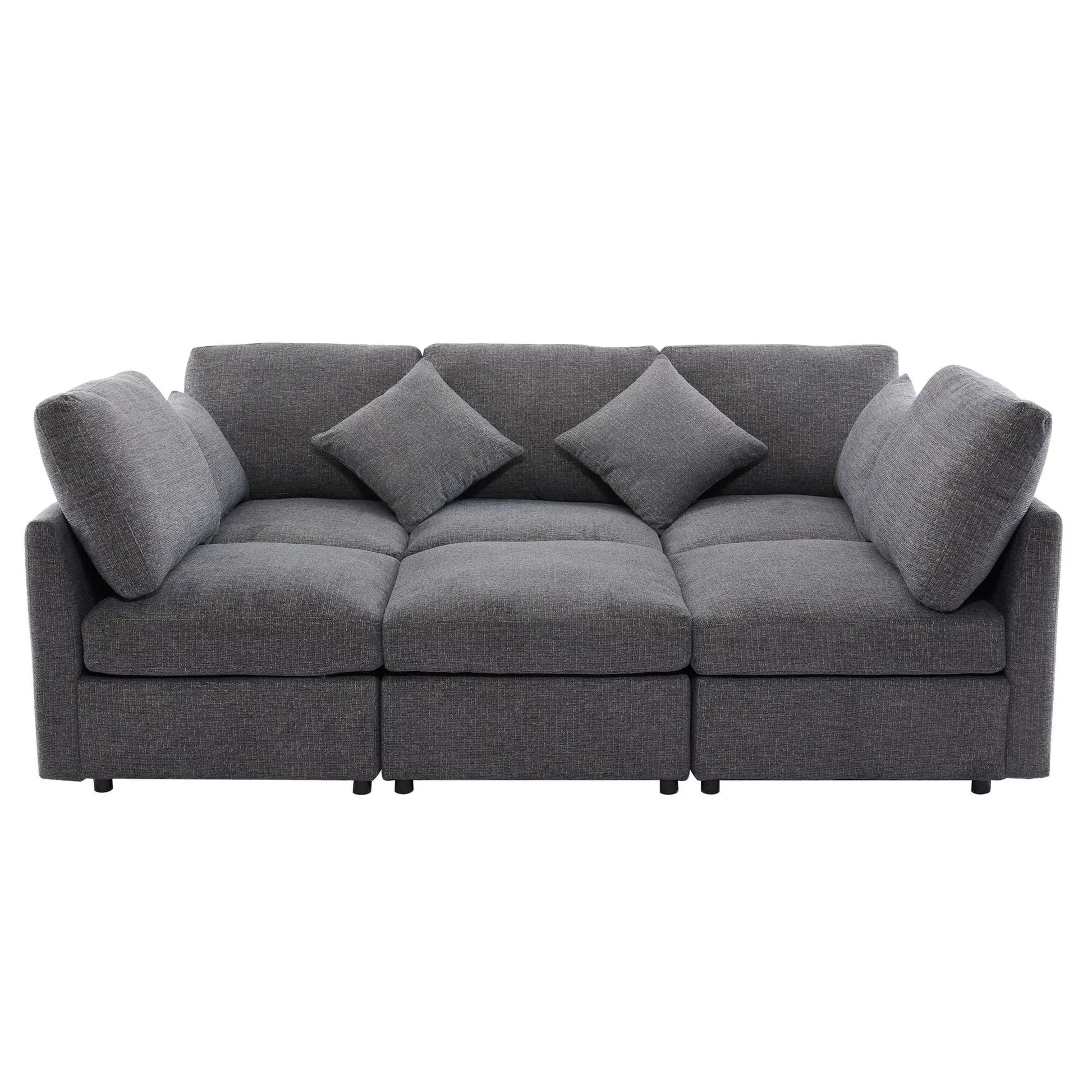 Gray modular sectional sofa with multiple back cushions and coordinating throw pillows on Tampa Home & Garden Store