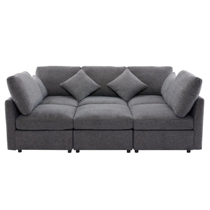 Gray modular sectional sofa with multiple back cushions and coordinating throw pillows on Tampa Home & Garden Store