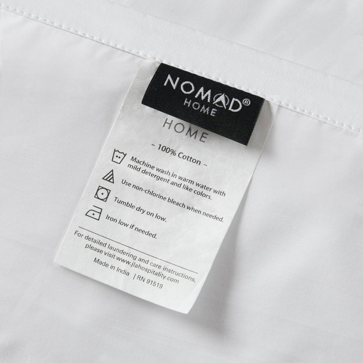 King Cotton Sheet Set white with NOMAD HOME label visible on Tampa Home & Garden Store