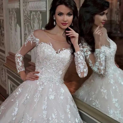 Wedding gown white lace with sheer illusion neckline and long floral lace sleeves on Tampa Home & Garden Store