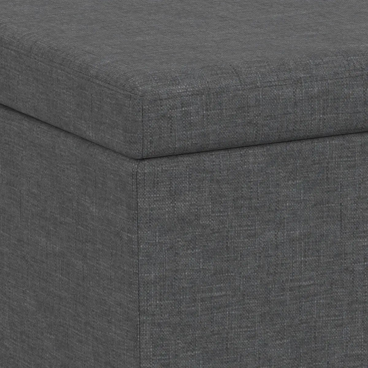Avalon multifunctional storage ottoman bench in dark gray textured fabric with corner seam on Tampa Home & Garden Store