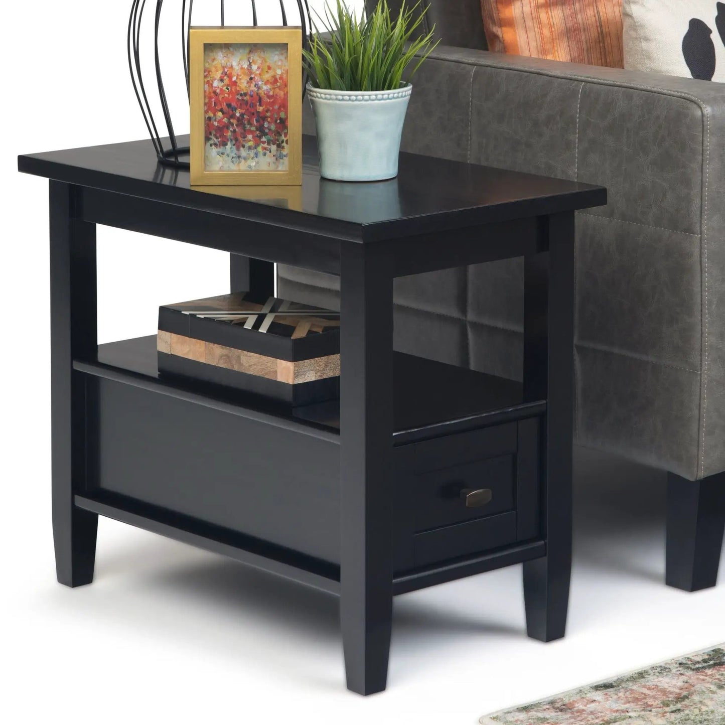 Warm Shaker coffee table in black finish with open shelf and gold-framed art plus blue planter on Tampa Home & Garden Store