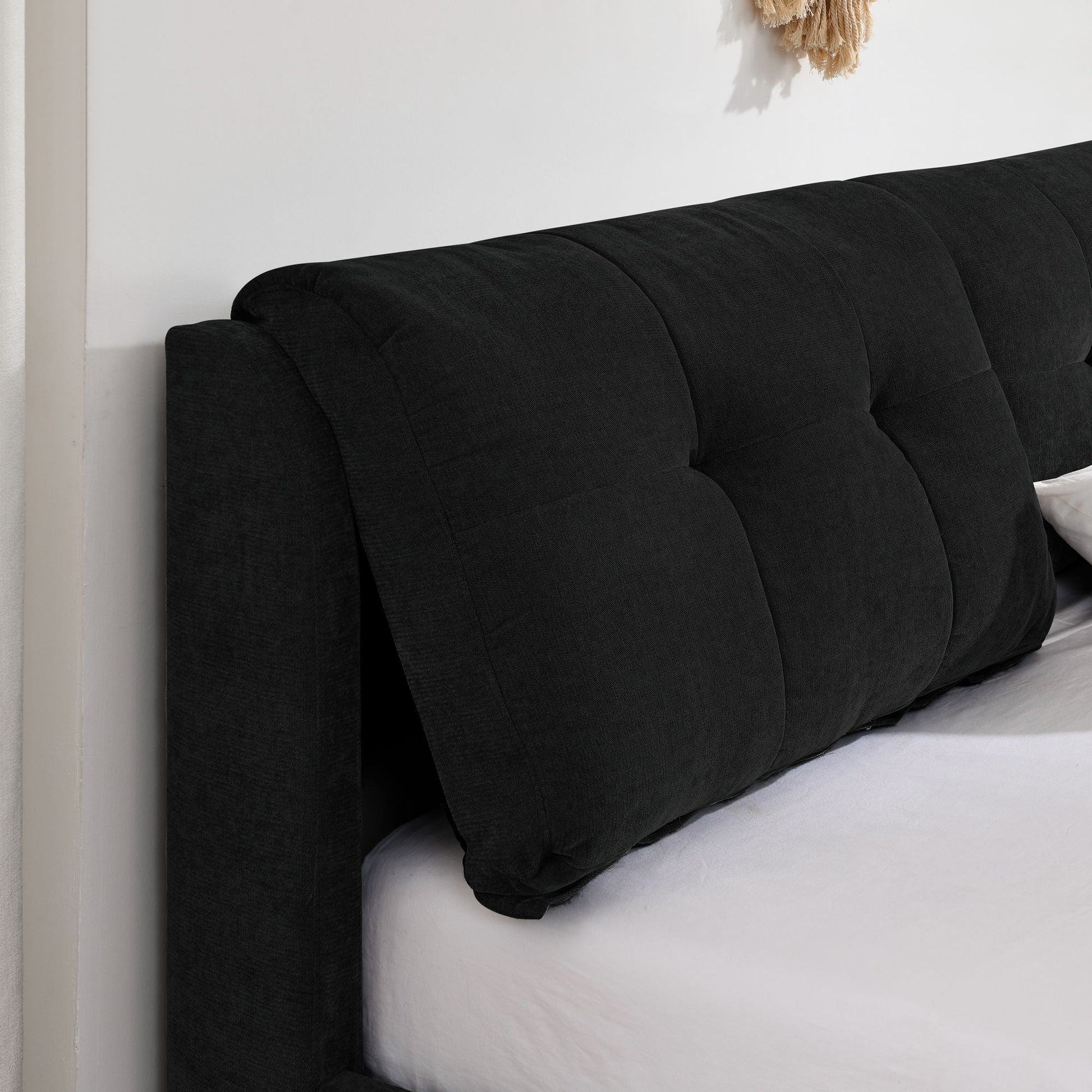 Storage hydraulic platform bed with integrated headboard, black tufted fabric side view on Tampa Home & Garden Store
