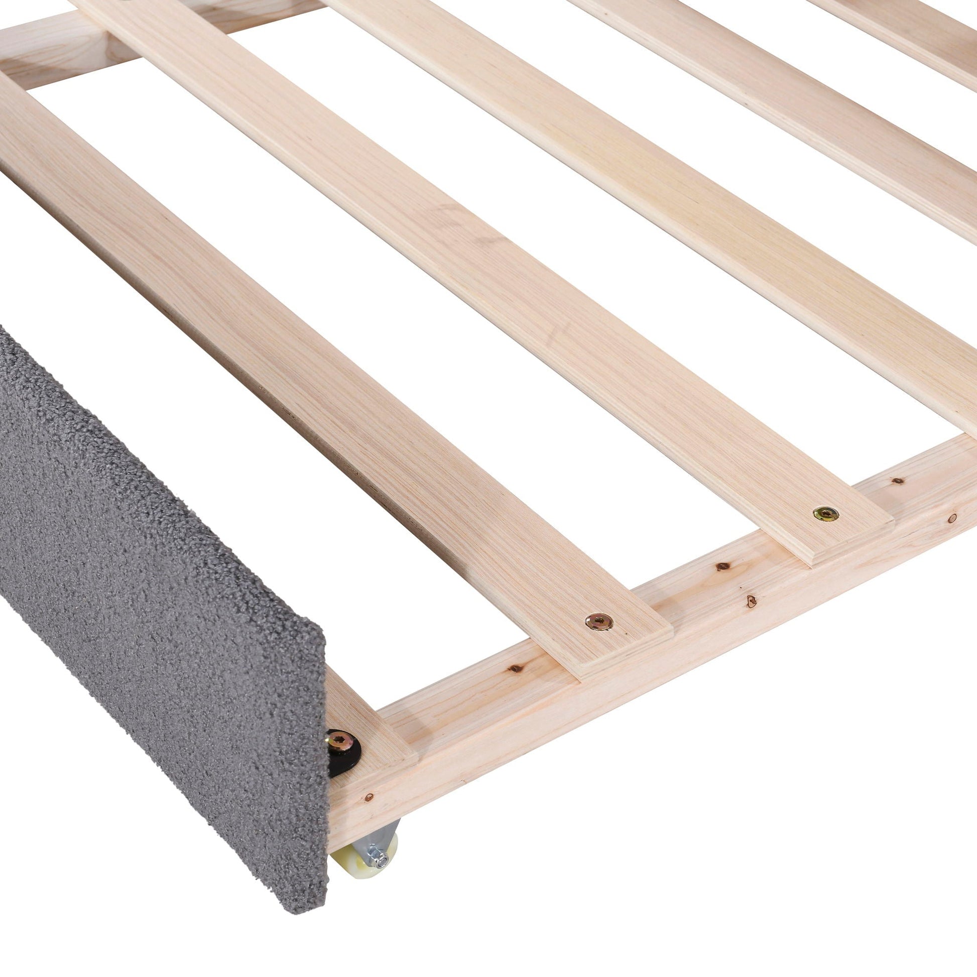 Trundle bed frame by HouseOfZazla with light wooden slats, visible screws and casters beside a gray rug on Tampa Home & Garden Store