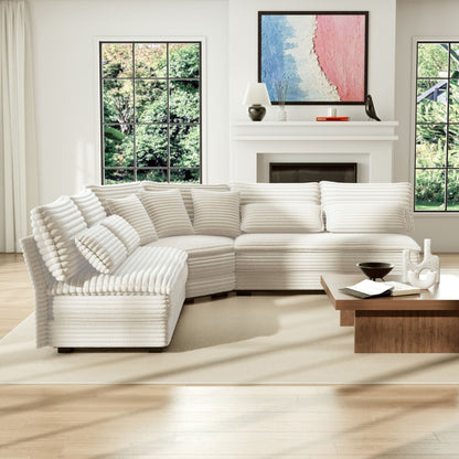 5-seat L-shaped sectional sofa with curved corner in white and 7 pillows in a modern living room on Tampa Home & Garden Store