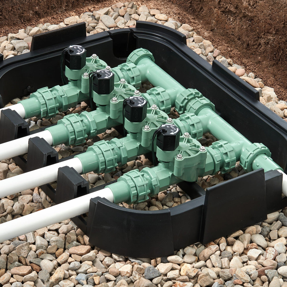 Orbit Irrigation 4-valve preassembled manifold with PVC adapters, green body, black actuators on Tampa Home & Garden Store