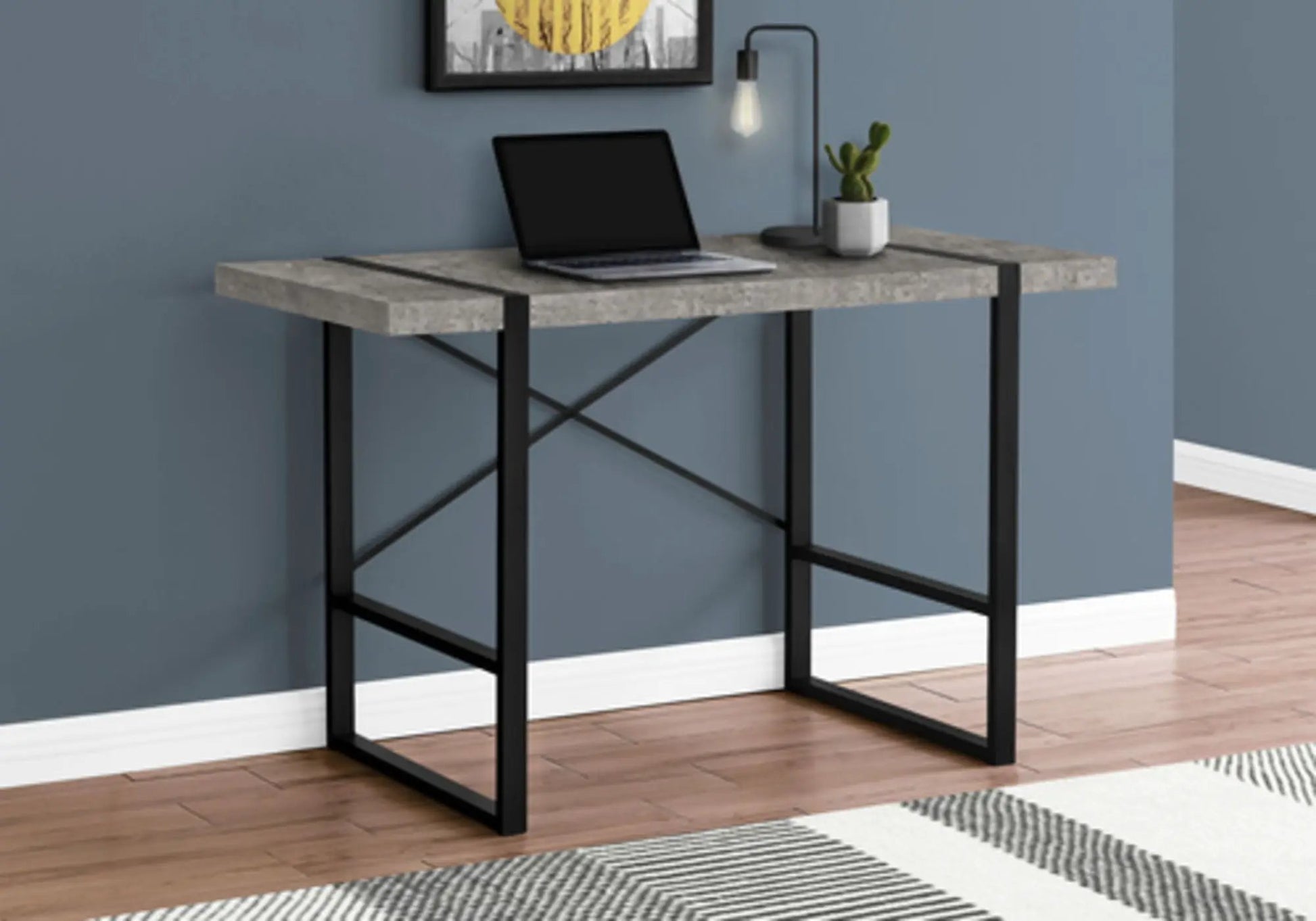 Industrial design computer desk with concrete top and black metal legs, laptop on desk on Tampa Home & Garden Store